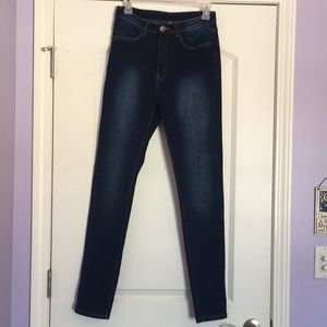 Dark wash, blue skinny jeans, high rise.